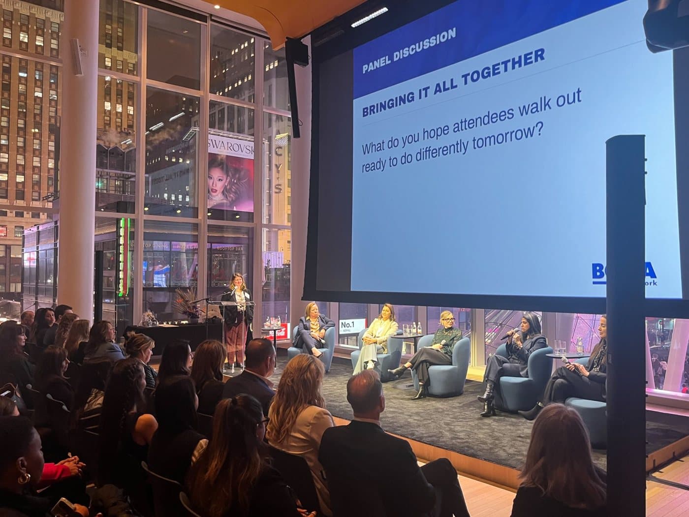 A BOMA New York panel on stage before a full room